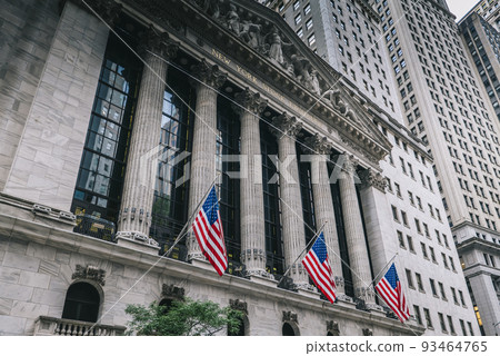 Front of the 1908 New York Stock Exchange on Broad Street with American flags on a front  93464765