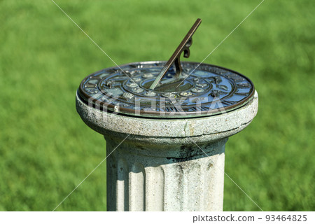 antique sundial on a pedestal in sunny day in garden, New Jersey Botanical Garden antique sundial on a pedestal in sunny day in garden, New Jersey Botanical Garden 93464825