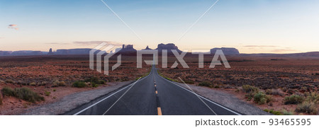 Scenic Road in the Dry Desert with Red Rocky Mountains in Background. Scenic Road in the Dry Desert with Red Rocky Mountains in Background. 93465595