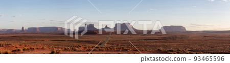 Scenic Road in the Dry Desert with Red Rocky Mountains in Background. Scenic Road in the Dry Desert with Red Rocky Mountains in Background. 93465596
