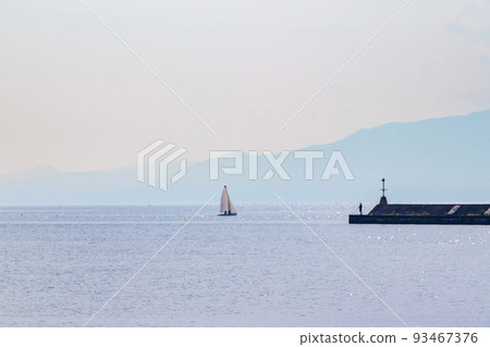 A small yacht floating off the harbor A small yacht floating off the harbor 93467376