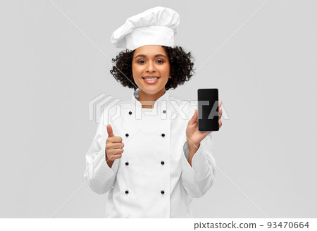 smiling female chef showing smartphone smiling female chef showing smartphone 93470664