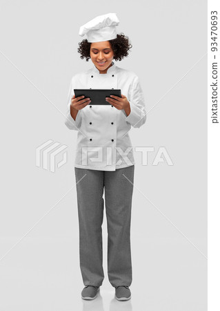smiling female chef with tablet computer smiling female chef with tablet computer 93470693