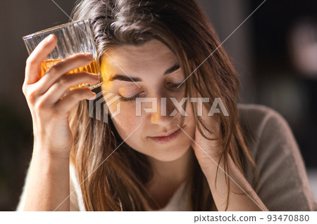 woman alcoholic drinking strong alcohol at home woman alcoholic drinking strong alcohol at home 93470880