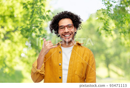 man making phone gesture on natural background man making phone gesture on natural background 93471113
