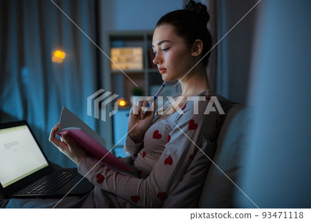 student girl with notebook and laptop at night student girl with notebook and laptop at night 93471118