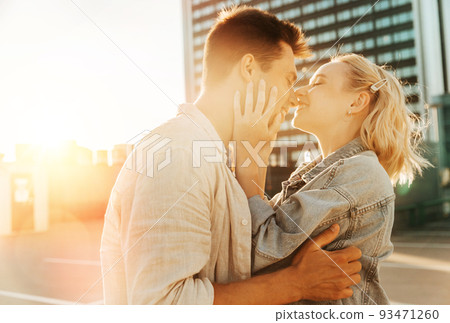 happy young couple on roof top city parking 93471260