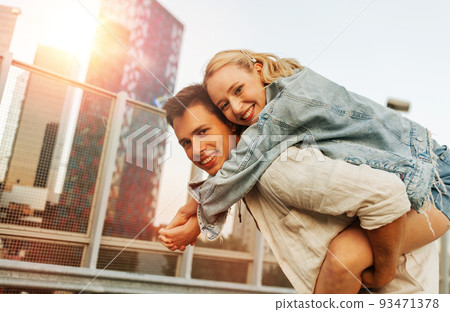 happy young couple having fun on roof top parking 93471378
