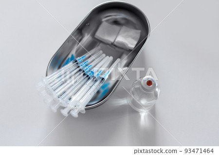 close up of syringes, sterile wipes and medicine 93471464