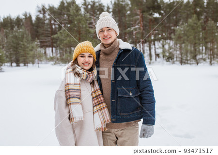 happy smiling couple in winter park 93471517