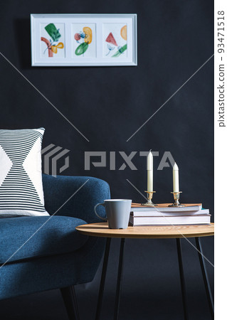 chair, coffee table and picture on black wall 93471518
