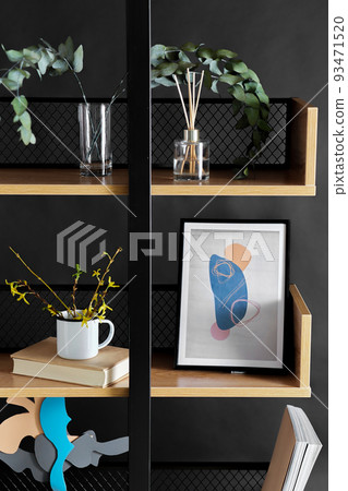 book shelf with art and home decor over black wall book shelf with art and home decor over black wall 93471520