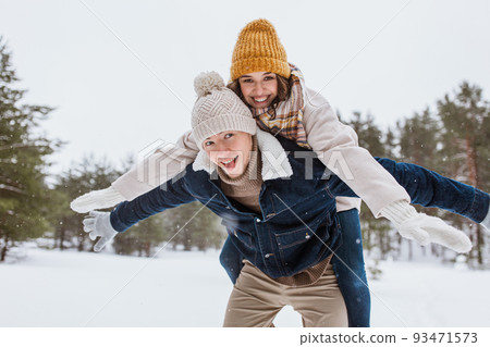 happy couple having fun in winter park happy couple having fun in winter park 93471573