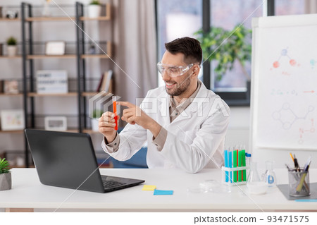 chemistry teacher with laptop having online class chemistry teacher with laptop having online class 93471575