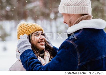 couple looking at each other in winter forest couple looking at each other in winter forest 93471578