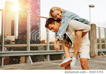 happy young couple having fun on roof top parking 93471745
