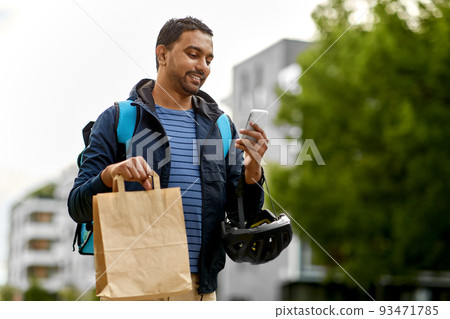 delivery man with takeaway food in bag and phone delivery man with takeaway food in bag and phone 93471785