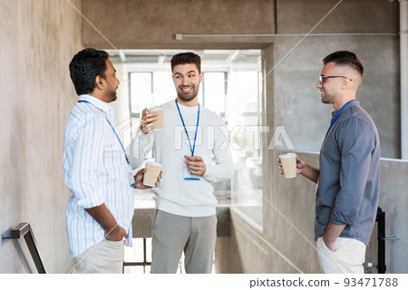 businessmen drinking takeaway coffee at office businessmen drinking takeaway coffee at office 93471788