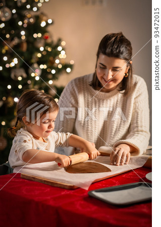mother and daughter making gingerbread at home mother and daughter making gingerbread at home 93472015