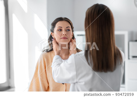 doctor checking lymph nodes of woman at hospital doctor checking lymph nodes of woman at hospital 93472059