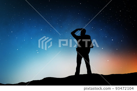 traveler standing on edge and looking far away 93472104
