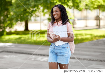 african student girl with notebooks in city african student girl with notebooks in city 93472260