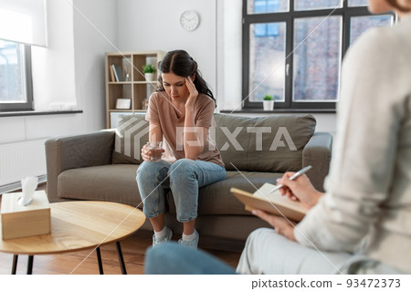 woman and psychologist at psychotherapy session woman and psychologist at psychotherapy session 93472373