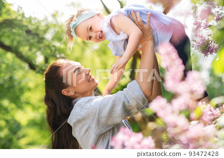 happy mother with little daughter at summer park happy mother with little daughter at summer park 93472428