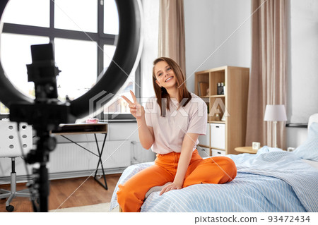 girl blogger with ring light streaming at home girl blogger with ring light streaming at home 93472434