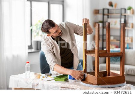 man with ruler measuring table for renovation man with ruler measuring table for renovation 93472651