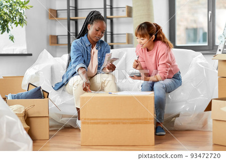 women moving to new home and counting money women moving to new home and counting money 93472720