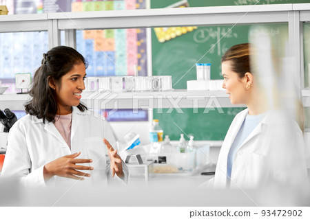international female scientists talk in laboratory international female scientists talk in laboratory 93472902
