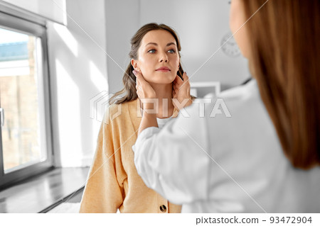 doctor checking lymph nodes of woman at hospital doctor checking lymph nodes of woman at hospital 93472904