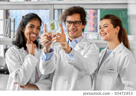 group of scientists with leaf in laboratory group of scientists with leaf in laboratory 93472953
