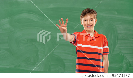 portrait of happy smiling boy showing four fingers portrait of happy smiling boy showing four fingers 93473127
