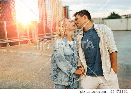 happy young couple on roof top city parking happy young couple on roof top city parking 93473161