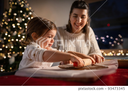 mother and daughter making gingerbread at home mother and daughter making gingerbread at home 93473345