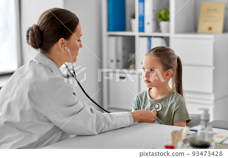 doctor with stethoscope and girl patient at clinic 93473428