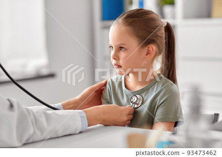 doctor with stethoscope and girl patient at clinic 93473462