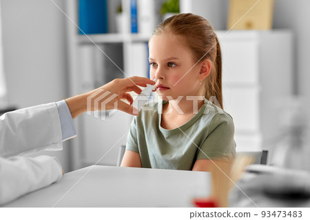 doctor with nasal spray and girl patient at clinic doctor with nasal spray and girl patient at clinic 93473483