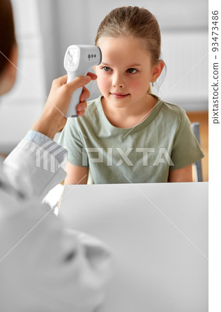 female doctor and little girl patient at clinic female doctor and little girl patient at clinic 93473486