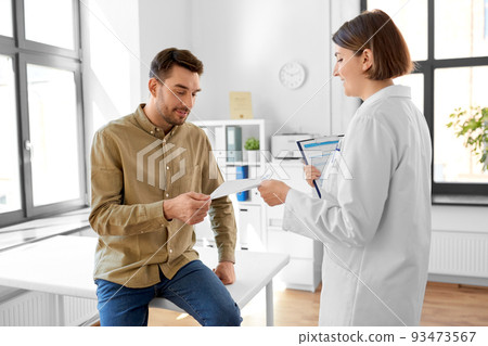 doctor giving prescription to patient at hospital doctor giving prescription to patient at hospital 93473567