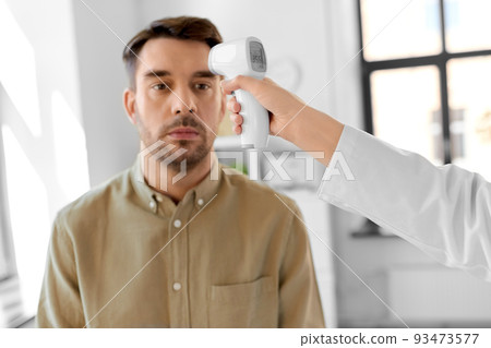 doctor with thermometer and man at hospital doctor with thermometer and man at hospital 93473577