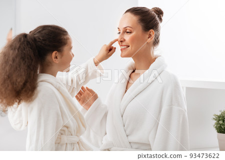 happy smiling mother and daughter at bathroom 93473622