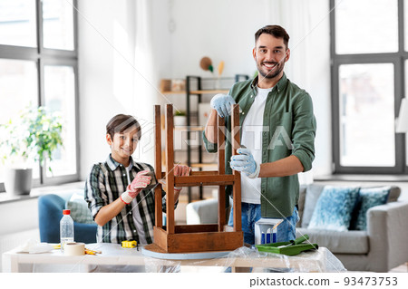 father and son sanding old table with sponge father and son sanding old table with sponge 93473753
