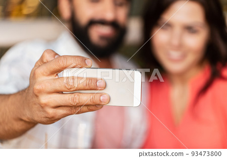 close up of couple taking selfie with smartphone 93473800