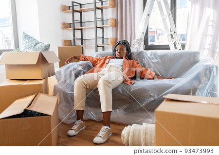 tired woman sleeping on sofa moving to new home tired woman sleeping on sofa moving to new home 93473993