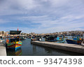 Port town with colorful ships 93474398
