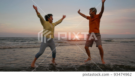 elderly couple take a jump 93474962