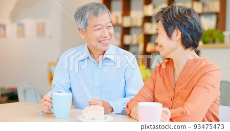 old couple drinking happily 93475473